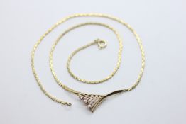 AN ELEGANT YELLOW METAL STONE SET NECKLET IN AN H. SAMUEL PRESENTATION BOX, L 40CM.