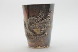AN ANTIQUE CHINESE EXPORT SILVER BEAKER, WITH RELIEF DRAGON AROUND THE BODY,