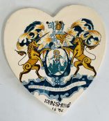 A GLAZED PLAQUE MARKED GLADSTONE POTTERY MUSEUM DECORATED AND SUPPLIED BY LONGTON,