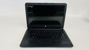 A HP NOTEBOOK COMPUTER MODEL 14 - AM069NA AND CHARGER - SOLD AS SEEN.