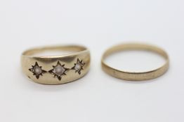 A 9CT GOLD WEDDING BAND + A 9CT GOLD 3 STONE GYPSY RING.