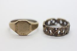 A 9CT GOLD RING OF PIERCED DESIGN SET WITH SMALL WHITE STONES (SOME MISSING,