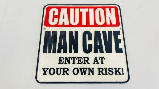 (R) CAUTION MAN CAVE SIGN.