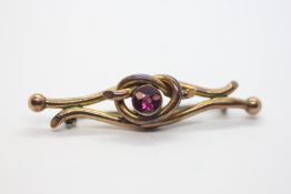 AN ANTIQUE 9CT GOLD BAR BROOCH,
