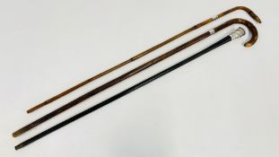 THREE VINTAGE WALKING STICKS TO INCLUDE A CANE WITH AN ELABORATE WHITE METAL WILD ANIMAL SCENE AND