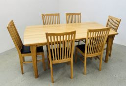 A MODERN OAK RECTANGULAR DINING TABLE AND A SET OF SIX LATHE BACK DINING CHAIRS.