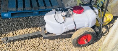 A TRAILERED TANK WITH 12V PUMP AND SPRAY ATTACHMENTS.