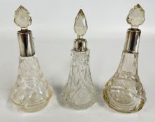 THREE VINTAGE SILVER COLLARED GLASS SCENT / DECANTER BOTTLES.