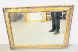 MODERN RECTANGULAR ORNATE GILT FRAMED WALL MIRROR WITH BEVELLED GLASS, 79 X 108CM.