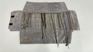 A RETAIL DISPLAY OF CHAIN NECKLACES.