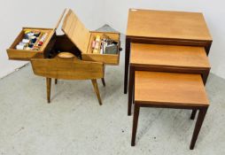 A VINTAGE SEWING BOX AND CONTENTS + A NEST OF THREE MID CENTURY TEAK TABLES.