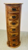 A RUSTIC HARD WOOD CYLINDRICAL SEVEN DRAWER TOWER, CHEST HEIGHT 104CM.