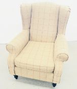 MODERN WING BACK FIRESIDE ARMCHAIR IN BROWN CHECK UPHOLSTERY.