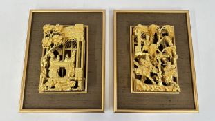 A PAIR OF ORIENTAL GOLD PAINTED WOODEN PANELS WITH INTRICATE CARVING DEPICTING WARRIORS ON