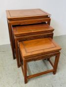 A NEST OF THREE GRADUATED CHINESE DESIGN REPRODUCTION CHERRYWOOD OCCASIONAL TABLES FEATURING