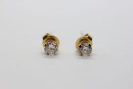 A PAIR OF 14CT YELLOW GOLD CZ SET STUD EARRINGS.