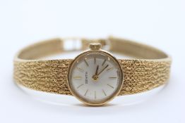 A LADY'S ZENITH 9CT GOLD COCKTAIL WATCH, THE DIAL WITH BATON NUMERALS,