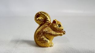 AN ESTEÈ LAUDER NOVELTY PERFUME COMPACT IN THE FORM OF A SQUIRREL.