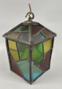 A VINTAGE MULTI COLOURED GLASS AND LEAD LANTERN.