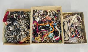 AN EXTENSIVE GROUP OF ASSORTED COSTUME JEWELLERY, BEADED NECKLACES, BANGLES, SIMULATED PEARLS ETC.