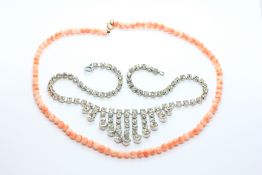 A 1940'S EVENING NECKLACE + A VINTAGE BEADED CORAL NECKLACE WITH 9CT GOLD CLASP.