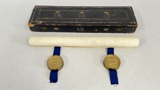 A VICTORIAN WARRANT WITH ORIGINAL WAX SEALS INCASED WITHIN GILT CONTAINERS SUSPENDED ON BLUE RIBBON