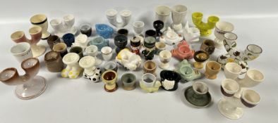 A BOX OF ASSORTED EGG CUPS TO INCLUDE CARLTON WARE, MASONS AND HORNSEA EXAMPLES.