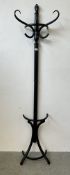 A MODERN BLACK FINISH WALL MOUNTED HALF COAT STAND.