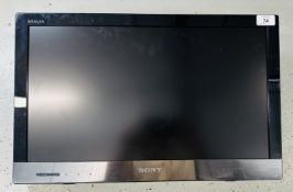 A WALL MOUNTED 22 INCH SONY TV MODEL NUMBER KDL - 22EX320 - SOLD AS SEEN.