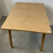 A MODERN LIGHT OAK FINISH EXTENDING BREAKFAST TABLE, 80 X 80 CLOSED.