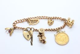 A 9CT GOLD CHARM BRACELET, ONE CHARM BEING A GEORGE V HALF SOVEREIGN 1912,