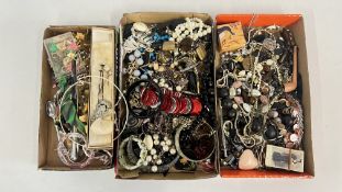 AN EXTENSIVE GROUP OF COSTUME JEWELLERY TO INCLUDE FASHION NECKLACES, BANGLES AND HAT PINS ETC.
