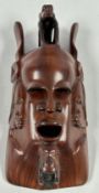 AN ETHNIC CARVED HARDWOOD MASK, H 48CM.