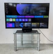 AN LG 43 INCH TV AND STAND, MODEL 43UR91006LA AND REMOTE - SOLD AS SEEN.