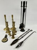 A GROUP OF FIRE IRONS AND TWO PAIRS OF VINTAGE CANDLESTICKS.