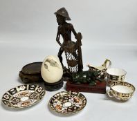 POLISHED HARD STONE MOULD OF A BUFFALO ON HARD WOOD STAND, TWO HARD WOOD STANDS,