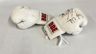 A PAIR OF BOXING GLOVES MARKED 