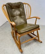 A MID CENTURY ROCKING CHAIR IN THE ERCOL STYLE.