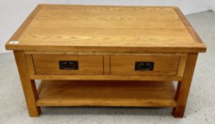 A MODERN TWO DRAWER OAK COFFEE TABLE.