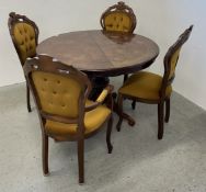 A REPRODUCTION CIRCULAR WALNUT FINISH EXTENDING DINING TABLE + SET OF 4 DINING CHAIRS.