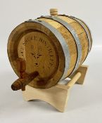 AN OAK BARREL AND STAND MARKED 