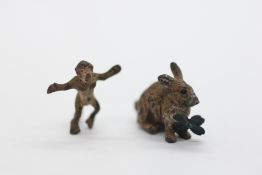 TWO VINTAGE MINIATURE COLD PAINTED FIGURES TO INCLUDE A MONKEY AND A RABBIT HOLDING A FOUR LEAF