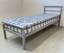 A MODERN METAL FRAMED SINGLE BED FRAME AND SINGLE MATTRESS.