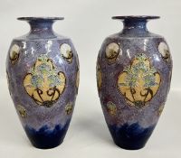 A PAIR OF ROYAL DOULTON STONEWARE VASES DECORATED WITH TUBE LINED ROUNDELS, ONE A/F.