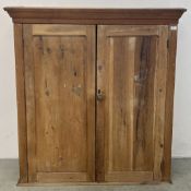 AN ANTIQUE WAXED PINE TWO DOOR PANTRY CUPBOARD, W 118CM X D 40CM X H 120CM.