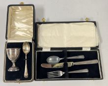 A CASED SILVER CHRISTENING EGG CUP AND SPOON,