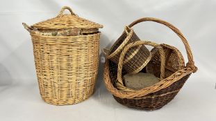 A GROUP OF WICKER BASKETS.