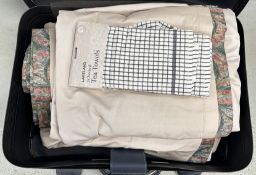 A SUITCASE CONTAINING TWO PAIRS OF GOOD QUALITY LINED CURTAINS AND A PACK OF LAKELAND TEA TOWELS.