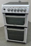 A HOTPOINT ULTIMA SLIMLINE ELECTRIC DOUBLE OVEN COOKER WITH CERAMIC HOB - SOLD AS SEEN.