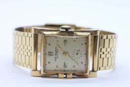 A VINTAGE 1950's JULES JURGENSEN 14CT GOLD CASED WRIST WATCH,